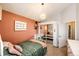 Cozy bedroom featuring a comfortable bed, closet with mirrored doors, and stylish decor at 18572 E Tanforan Pl, Aurora, CO 80015