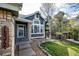 Inviting front entrance with stone accents and a neatly landscaped garden area at 18572 E Tanforan Pl, Aurora, CO 80015