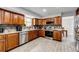 Modern kitchen featuring granite countertops, stainless steel appliances and tile backsplash at 18572 E Tanforan Pl, Aurora, CO 80015