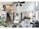 Bright living room with high ceilings, an open layout and hardwood-style floors at 18572 E Tanforan Pl, Aurora, CO 80015