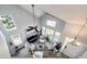 Bright living room featuring high ceilings, many windows, stylish furnishings and decor at 18572 E Tanforan Pl, Aurora, CO 80015