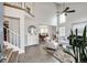 Bright living room with high ceilings, an open layout and hardwood-style floors at 18572 E Tanforan Pl, Aurora, CO 80015