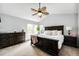 Serene main bedroom with a large bed, a ceiling fan, and a bright window at 18572 E Tanforan Pl, Aurora, CO 80015