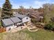 Aerial view of a home's landscaped backyard, featuring a patio, a seating area, and a rock garden at 17900 E Mexico Dr, Aurora, CO 80017