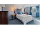 Bedroom featuring a blue color scheme and forest wall art at 17900 E Mexico Dr, Aurora, CO 80017