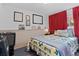 Comfortable bedroom with a queen-sized bed, soft lighting, and red curtains to create a cozy atmosphere at 17900 E Mexico Dr, Aurora, CO 80017