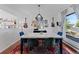 Bright dining room featuring guitars and an eclectic gallery wall for added charm at 17900 E Mexico Dr, Aurora, CO 80017