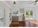 Bright kitchen with updated appliances, stone countertops, and a garden view at 17900 E Mexico Dr, Aurora, CO 80017
