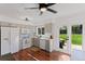 Bright kitchen with stainless steel appliances, stone countertops, and a view to the backyard at 17900 E Mexico Dr, Aurora, CO 80017