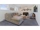 Cozy living room with plush sofa, brick fireplace, and stylish decor creates a welcoming ambiance at 17900 E Mexico Dr, Aurora, CO 80017