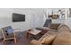 Spacious living room showcasing a comfortable seating area and stairway at 17900 E Mexico Dr, Aurora, CO 80017