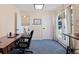 Comfortable home office with natural light, a large window, and desk space for remote work or studying at 17900 E Mexico Dr, Aurora, CO 80017
