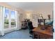 Well-lit home office featuring natural light, a large window, and multiple desk spaces for productivity at 17900 E Mexico Dr, Aurora, CO 80017