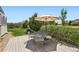 Charming back deck with outdoor seating, a large umbrella, and a serene backyard view at 22197 E Stroll Ave, Parker, CO 80138