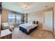 Comfortable bedroom with plenty of natural light from the window at 22197 E Stroll Ave, Parker, CO 80138