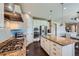 Spacious kitchen with stainless appliances, granite countertops, center island, and stylish pendant lighting at 22197 E Stroll Ave, Parker, CO 80138