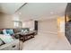 Large basement living room with plush carpeting, neutral paint, recessed lighting, and ample seating at 22197 E Stroll Ave, Parker, CO 80138
