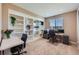 Functional home office featuring built-in shelving, a large window, and ample workspace at 22197 E Stroll Ave, Parker, CO 80138