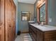 Stylish bathroom featuring modern vanity, fixtures, and a bright window, for a luxurious feel at 28592 Hummingbird Hill Rd, Conifer, CO 80433