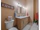 Well-lit bathroom with double vanity, marble countertops, and modern fixtures, offering a clean and stylish design at 28592 Hummingbird Hill Rd, Conifer, CO 80433