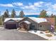 Charming home with mountain views, inviting entryway and large driveway at 28592 Hummingbird Hill Rd, Conifer, CO 80433