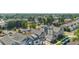 An aerial view of townhomes and the neighborhood features mature trees and plenty of street parking at 1530 Terry St, Longmont, CO 80501