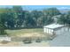 Large backyard surrounded by mature trees, providing ample space for outdoor activities and privacy at 1530 Terry St, Longmont, CO 80501