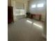 Bright bedroom featuring large windows, a desk, and a dark wood armoire at 1530 Terry St, Longmont, CO 80501