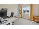 Bright bedroom with a work space setup featuring a large window providing natural light at 1530 Terry St, Longmont, CO 80501