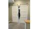 View of a closet featuring a sliding barn door and a closet organization system for optimized storage at 1530 Terry St, Longmont, CO 80501