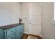 Entryway featuring blue dresser, coat rack and tile entry at 1530 Terry St, Longmont, CO 80501