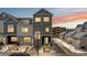Townhouse exterior featuring a well-manicured lawn, garage, and gray-blue paint scheme at 1530 Terry St, Longmont, CO 80501