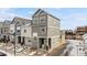 Modern two-story townhome featuring a stylish gray exterior and well-maintained landscaping at 1530 Terry St, Longmont, CO 80501