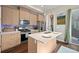 Bright kitchen with stainless steel appliances, a center island, and modern cabinetry at 1530 Terry St, Longmont, CO 80501