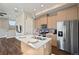 Bright kitchen with stainless steel appliances, a center island, and modern cabinetry at 1530 Terry St, Longmont, CO 80501