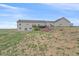Expansive backyard with a multi-tiered deck, offering ample space for outdoor activities and relaxation at 14551 N Harback Rd, Keenesburg, CO 80643