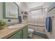 Functional bathroom features a shower/tub combo and vanity storage, providing a practical and tidy space for daily routines at 14551 N Harback Rd, Keenesburg, CO 80643