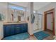 Well-lit bathroom featuring double sinks, ample counter space, and a glass-enclosed shower for a spa-like experience at 14551 N Harback Rd, Keenesburg, CO 80643