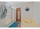 Relaxing bathroom featuring a glass shower and a soaking tub with a scenic hanging for a spa-like experience at 14551 N Harback Rd, Keenesburg, CO 80643