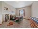 Bright bedroom with a comfortable bed, natural light, and ample space for study, perfect for students or growing children at 14551 N Harback Rd, Keenesburg, CO 80643