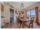 Inviting dining room with a sliding glass door to a fenced yard and stylish decor for comfortable Gathering gatherings at 14551 N Harback Rd, Keenesburg, CO 80643