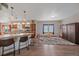Bright, open living space connects the kitchen with the living room area at 14551 N Harback Rd, Keenesburg, CO 80643