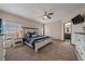 Cozy main bedroom with a large bed, plush carpet, and serene views from the windows for restful nights at 14551 N Harback Rd, Keenesburg, CO 80643