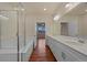 Bathroom features a luxurious soaking tub, a glass shower, and double vanity with generous counter space at 152 Ambrose St, Erie, CO 80516
