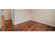 This is a bright bedroom with wood floors, neutral walls, and a closet at 152 Ambrose St, Erie, CO 80516