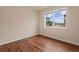 Bright bedroom with view of townhomes and garages through the window at 152 Ambrose St, Erie, CO 80516