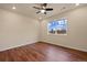 Bright bedroom with hardwood floors, a ceiling fan, and a large window at 152 Ambrose St, Erie, CO 80516