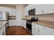 Well-equipped kitchen with stainless steel appliances and ample cabinet space at 152 Ambrose St, Erie, CO 80516