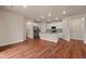 Modern kitchen features stainless steel appliances, white cabinetry, and an island at 152 Ambrose St, Erie, CO 80516