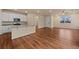 Modern kitchen with stainless steel appliances and an island connected to the living room at 152 Ambrose St, Erie, CO 80516